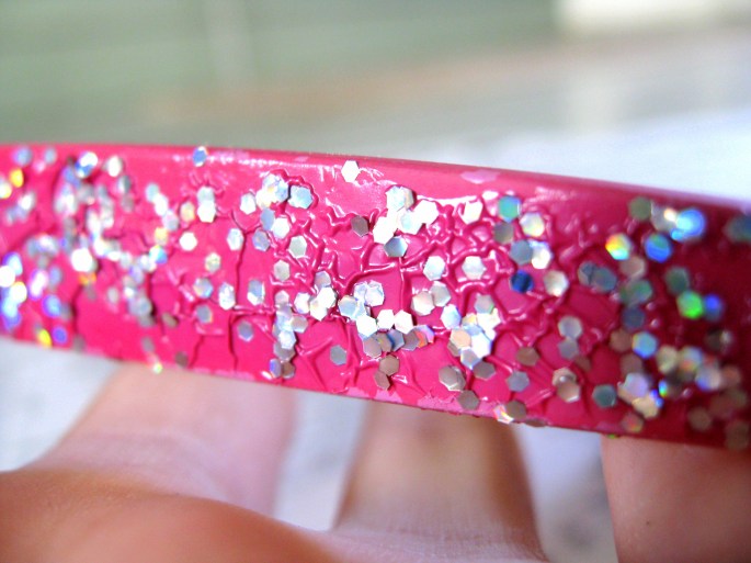 sparkly pink nail polish effect on paint